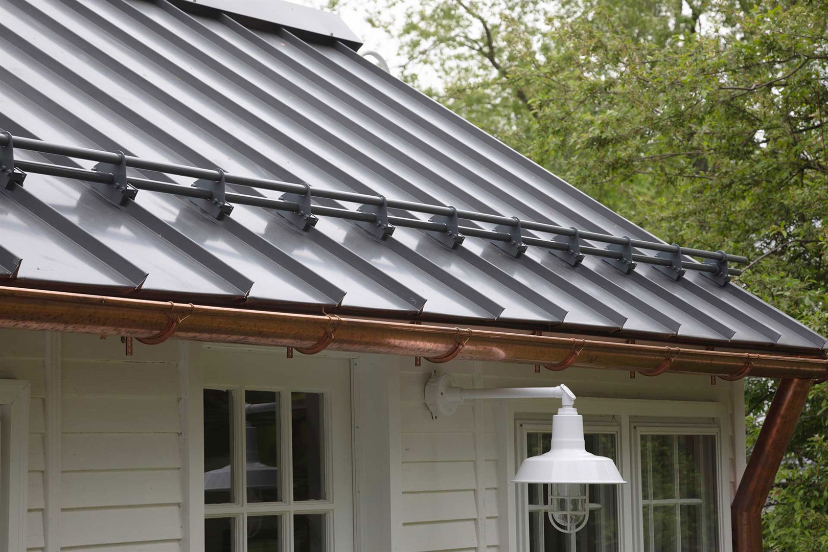 Stylish powder-coated metal roof snow stops chosen by homeowner