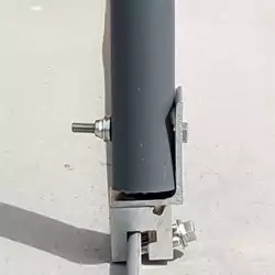 Non-penetrating metal roof clamp