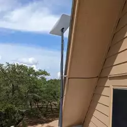 Starlink antenna installation on metal roof