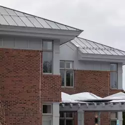 AceClamp snow bars installed on metal roof for snow retention