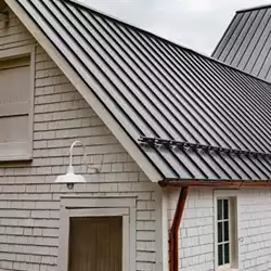 AceClamp 2-Bar metal roof snow stops, powder coated and installed on a powder-coated metal roof in Enfield, CT.