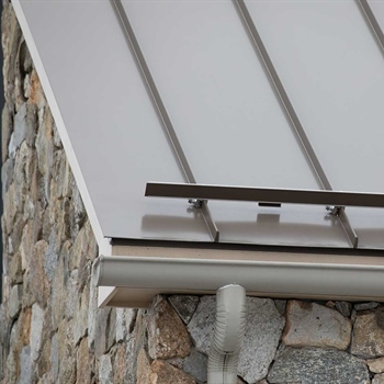 Color Snap snow retention installed on metal roofing with snap-in ice clips