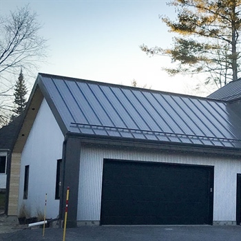Efficient Color Snap® snow guards for metal roofing installed at Hunter's Hollow