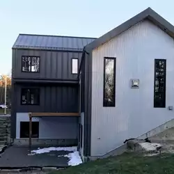 Hunter's Hollow protected by AceClamp snow guards for metal roofing