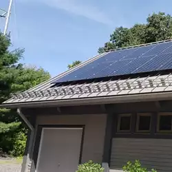 Close-up of AceClamp solar panel snow guards on a rooftop